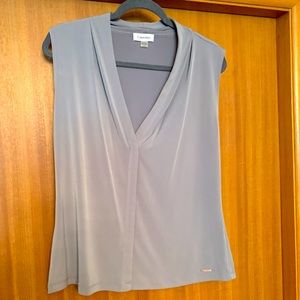 Callin Klein sleeveless gray blouse, excellent condition.